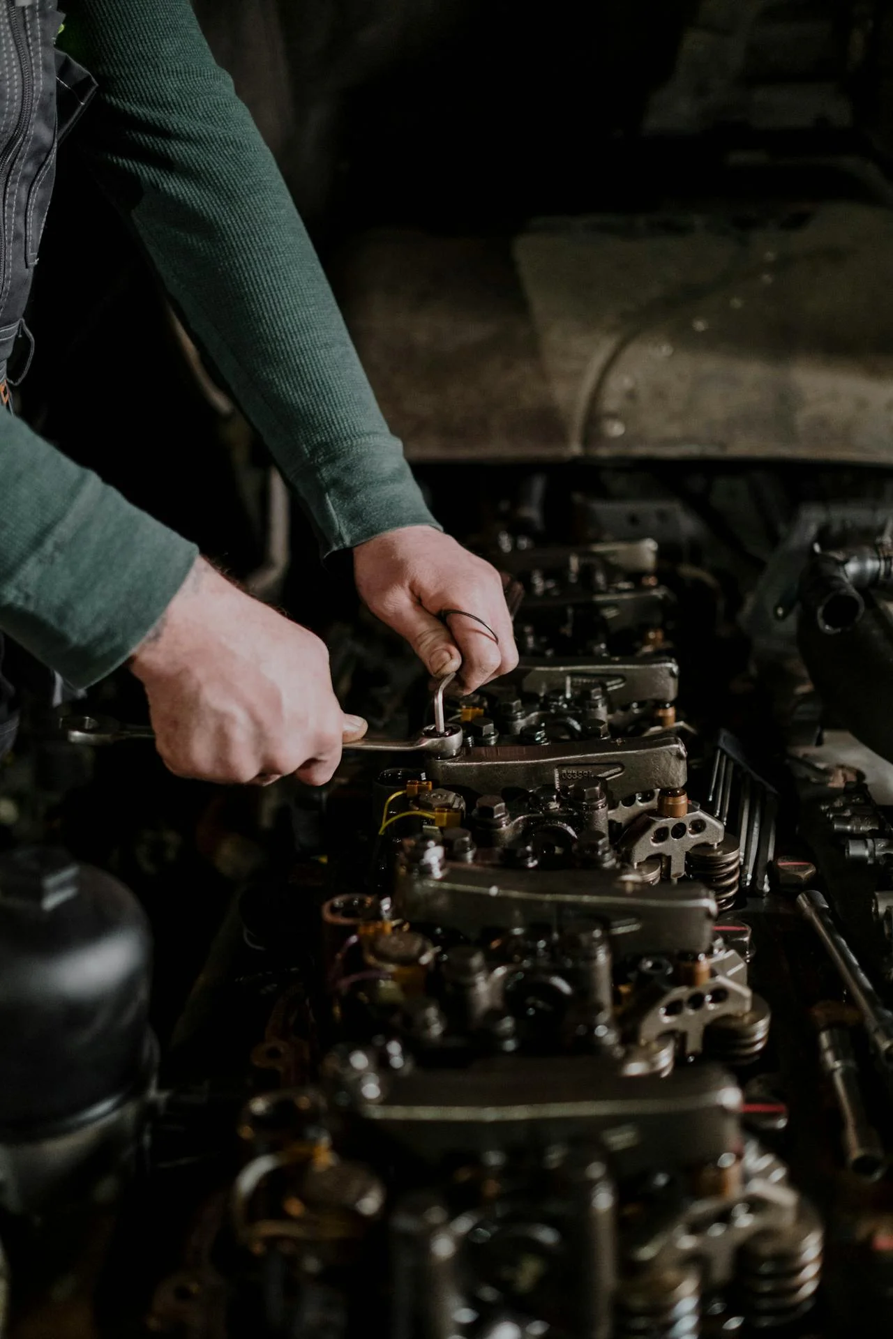 man working on engine repair